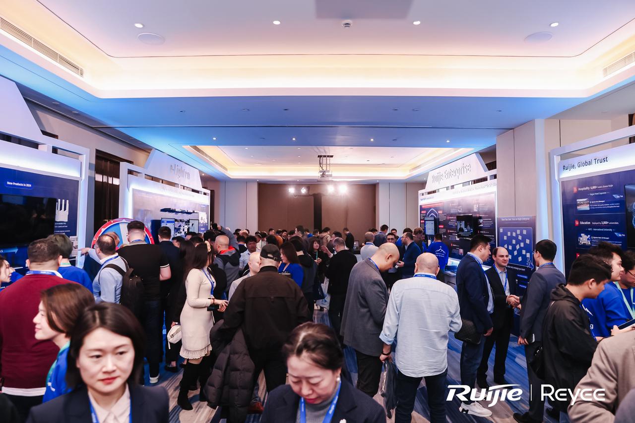 Attendees discussing at the exhibition area