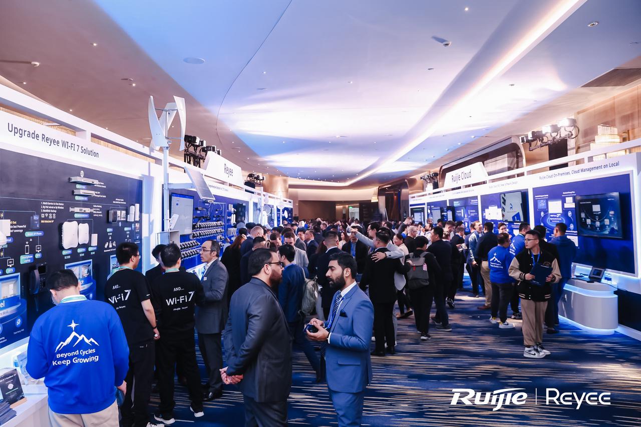 Attendees discussing at the exhibition area