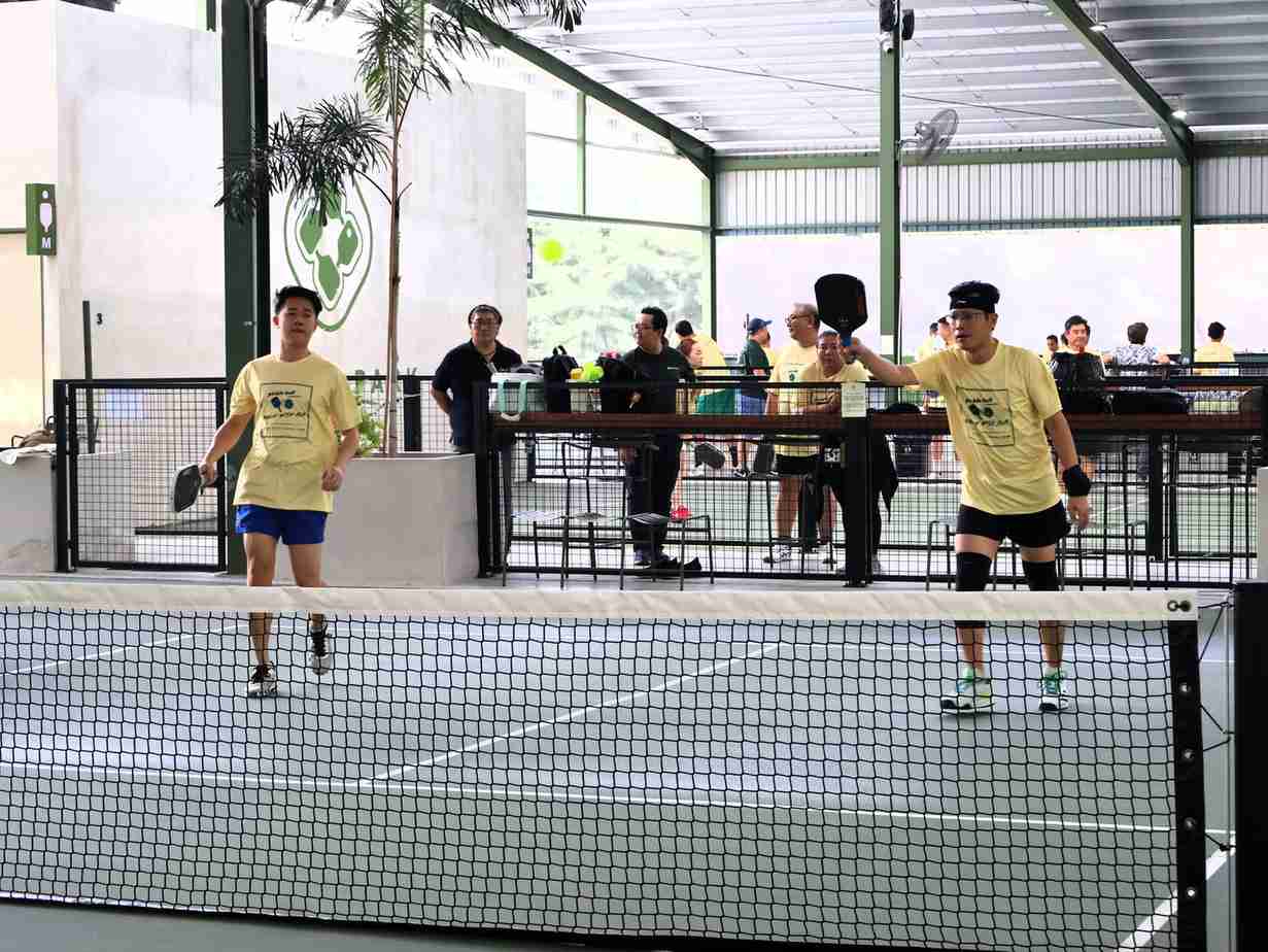 Partners in action during a pickleball match