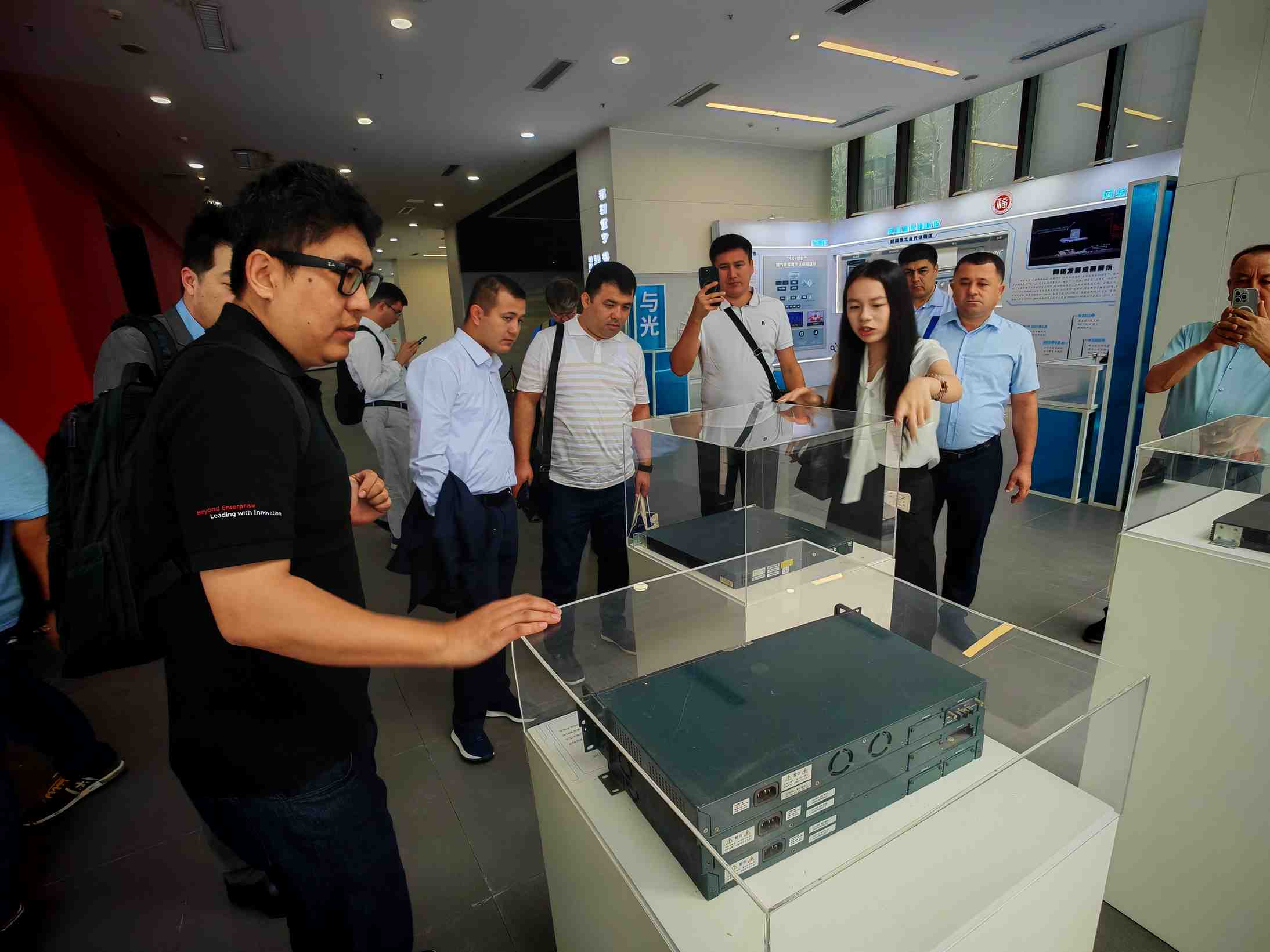 Delegates examining network equipment on display