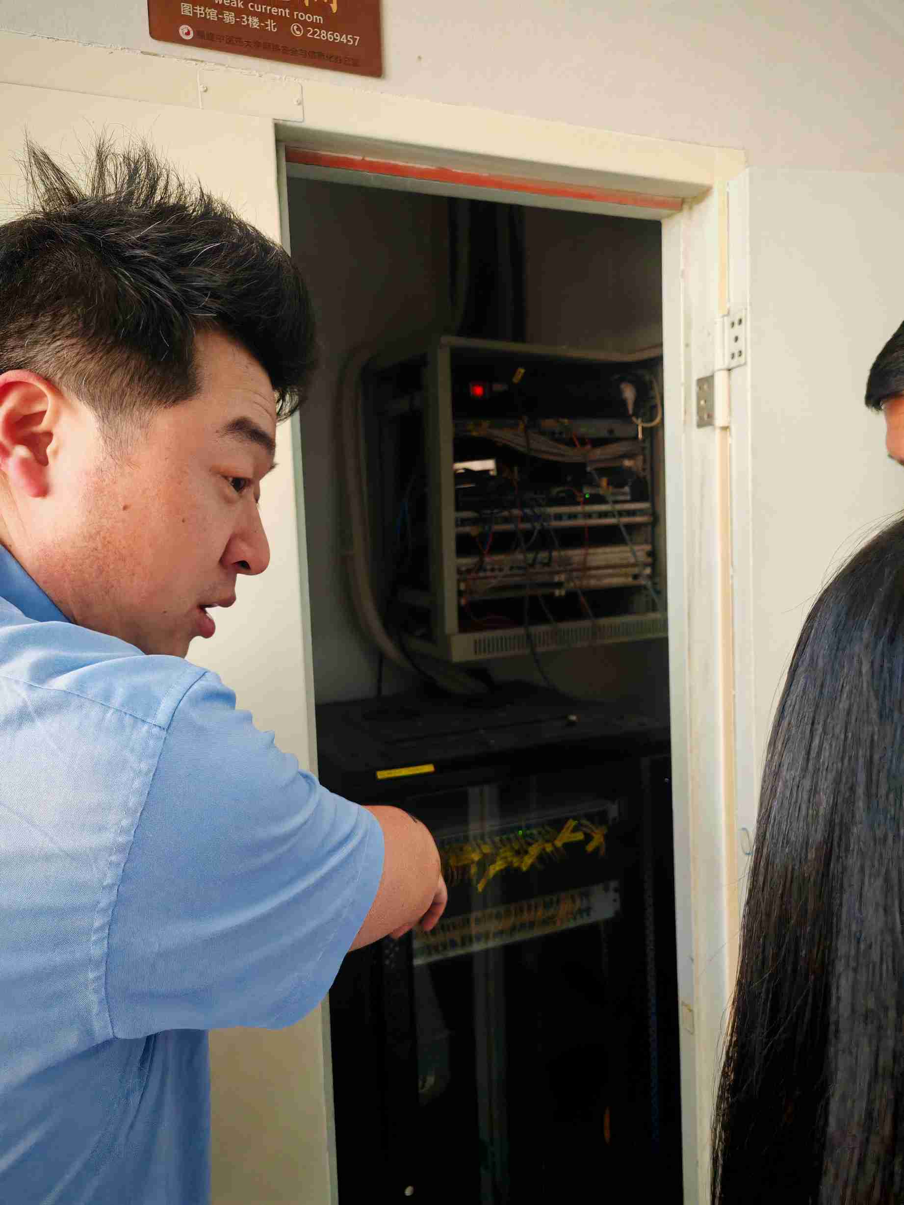 Delegates inspecting a network equipment room