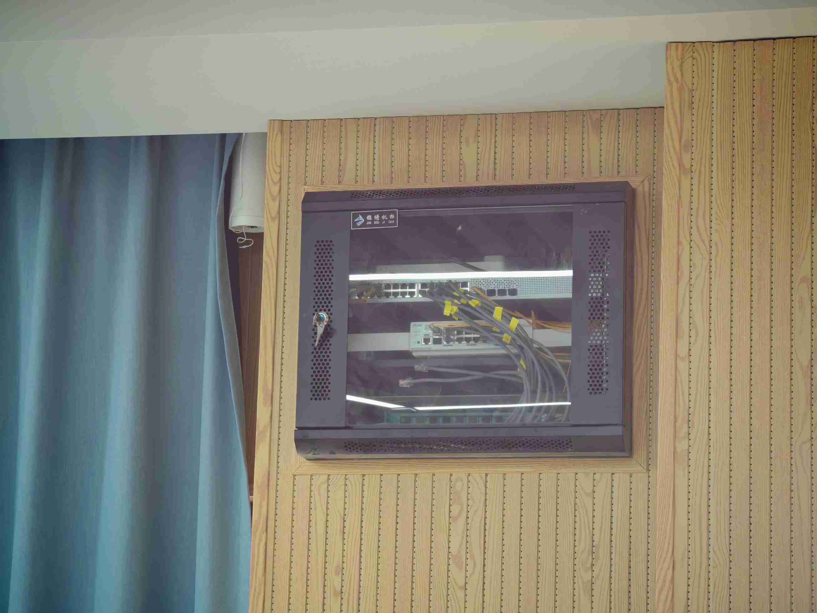 Wall-mounted network switch cabinet installation